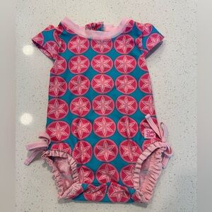Ruffle Butts Pink & Blue Sand dollar one-piece swimsuit